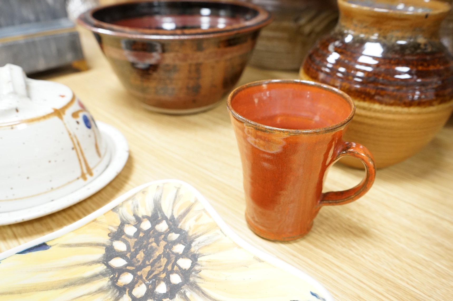A Poole pottery Aegean dish, together with a selection of Studio pottery bowls, dishes, jugs etc and a Donoghue / Rye cottage model, Poole dish 20cm diameter (14)